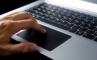 Person using gray laptop computer