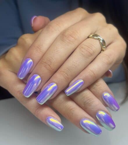Long, square-shaped nails with soft edges and a shiny metallic purple finish.