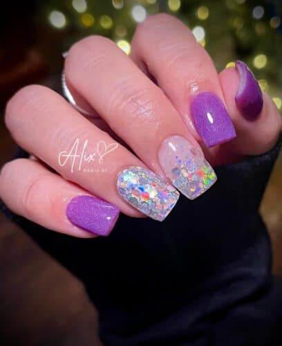 Various shades of purple nails with intricate glitter patterns and geometric designs.