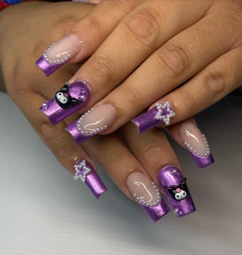 Long, squared nails with a shiny purple base, detailed with bead patterns and cartoon characters.