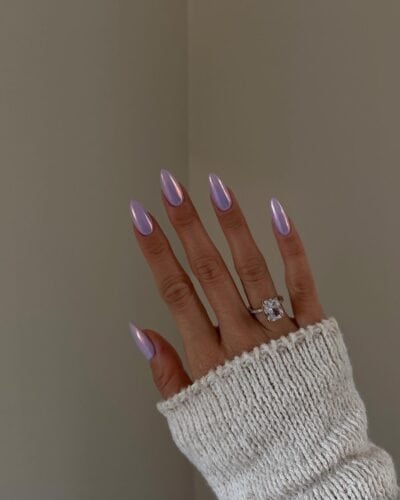 Almond-shaped nails with a metallic mauve finish, exuding a soft iridescence perfect for spring.