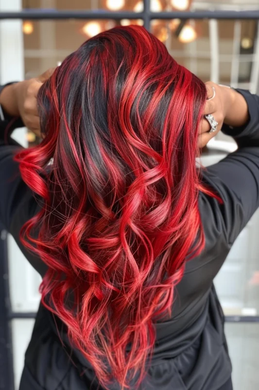 Woman with bright red hair with highlights