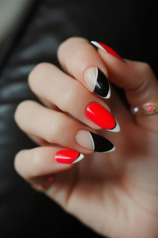 White French tips on black and red nails.
