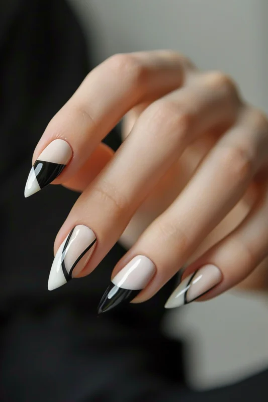 Stiletto nails with modern French tips.