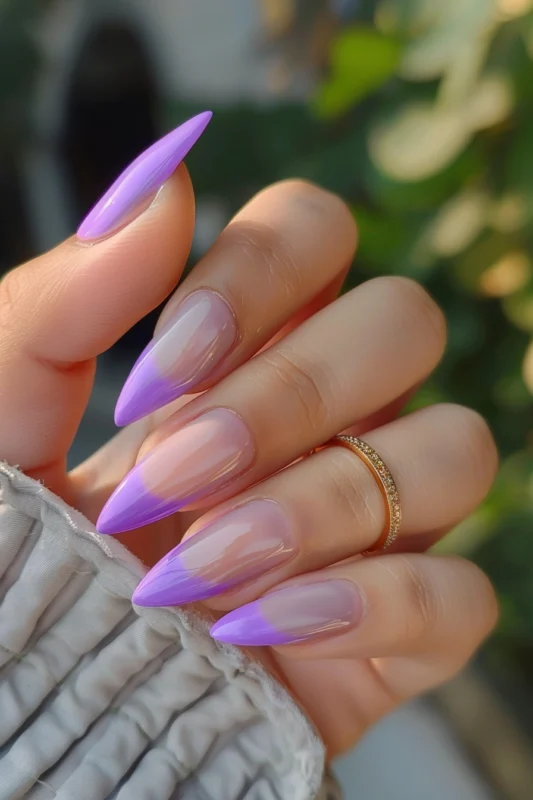 Purple French tips on stiletto nails.