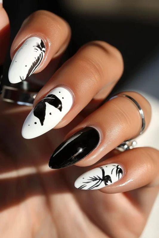 Glossy black and matte white abstract nails.