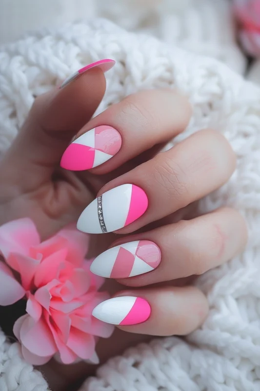 Two-toned pink color blocks on white almond nails with a silver glitter line on one accent nail.