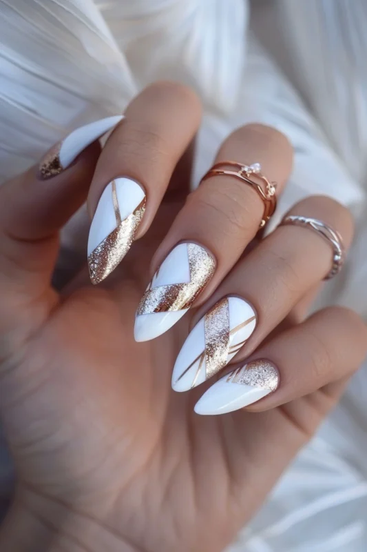 White nails with rose gold geometric patterns and shimmer.