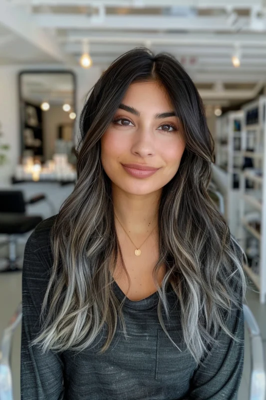 Woman with black hair and silver-tipped ends.