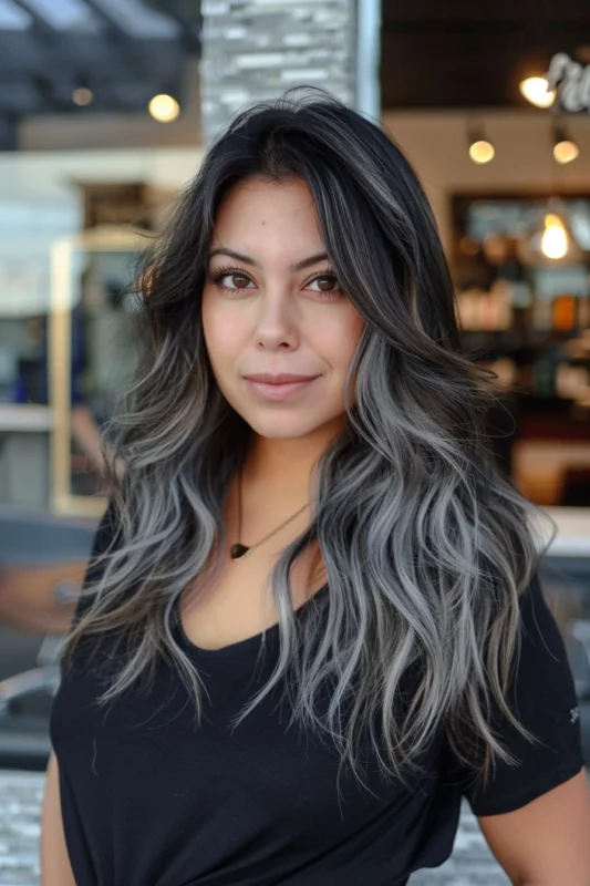 Woman with black top and grey ombre hair.
