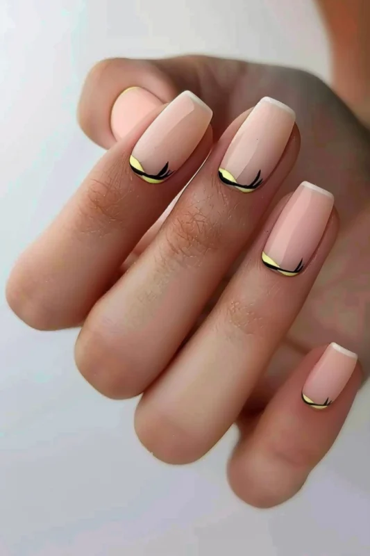 Light pink nails with white tips and yellow and black lines.