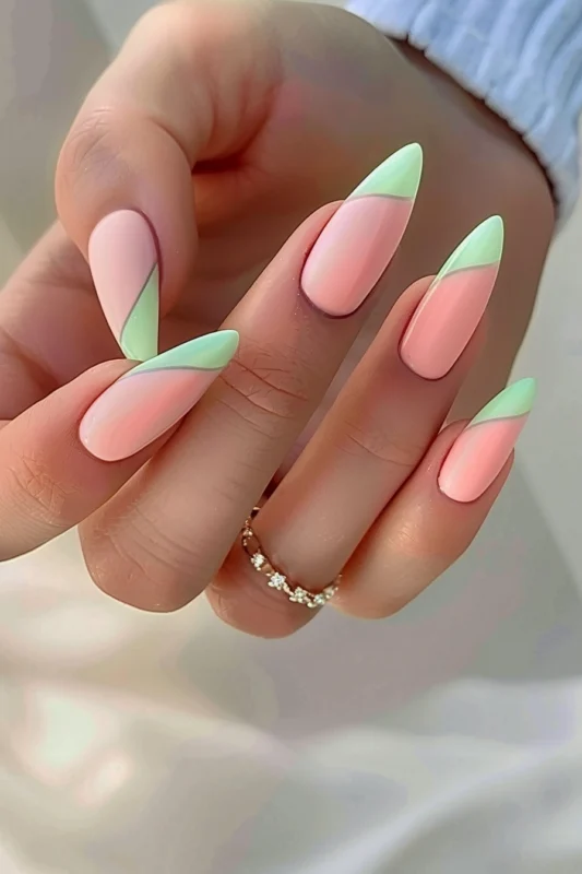 Salmon pink nails with a neon yellow French tip.