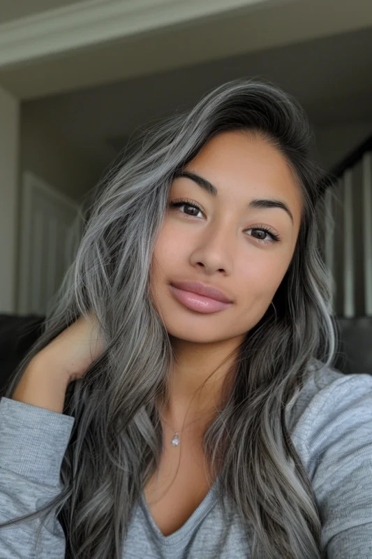 Woman with silver and black blended hair.