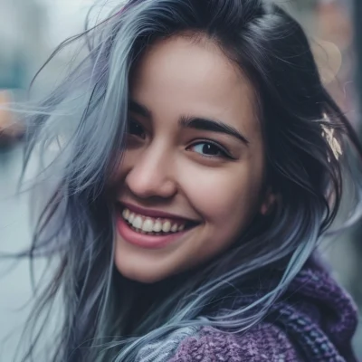 Young woman with silver highlights in dark hair.