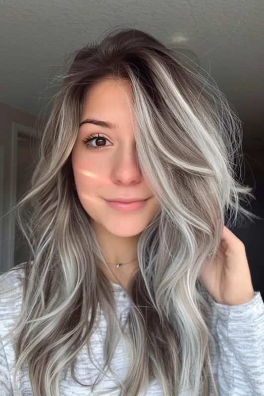Brown hair with luminous white and silver highlights.