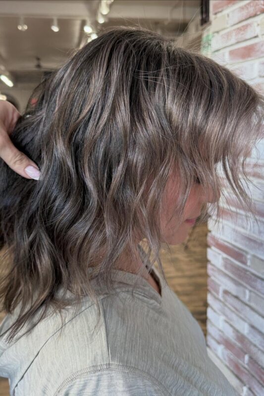 Brown hair with soft brown lowlights for subtle gray blending.