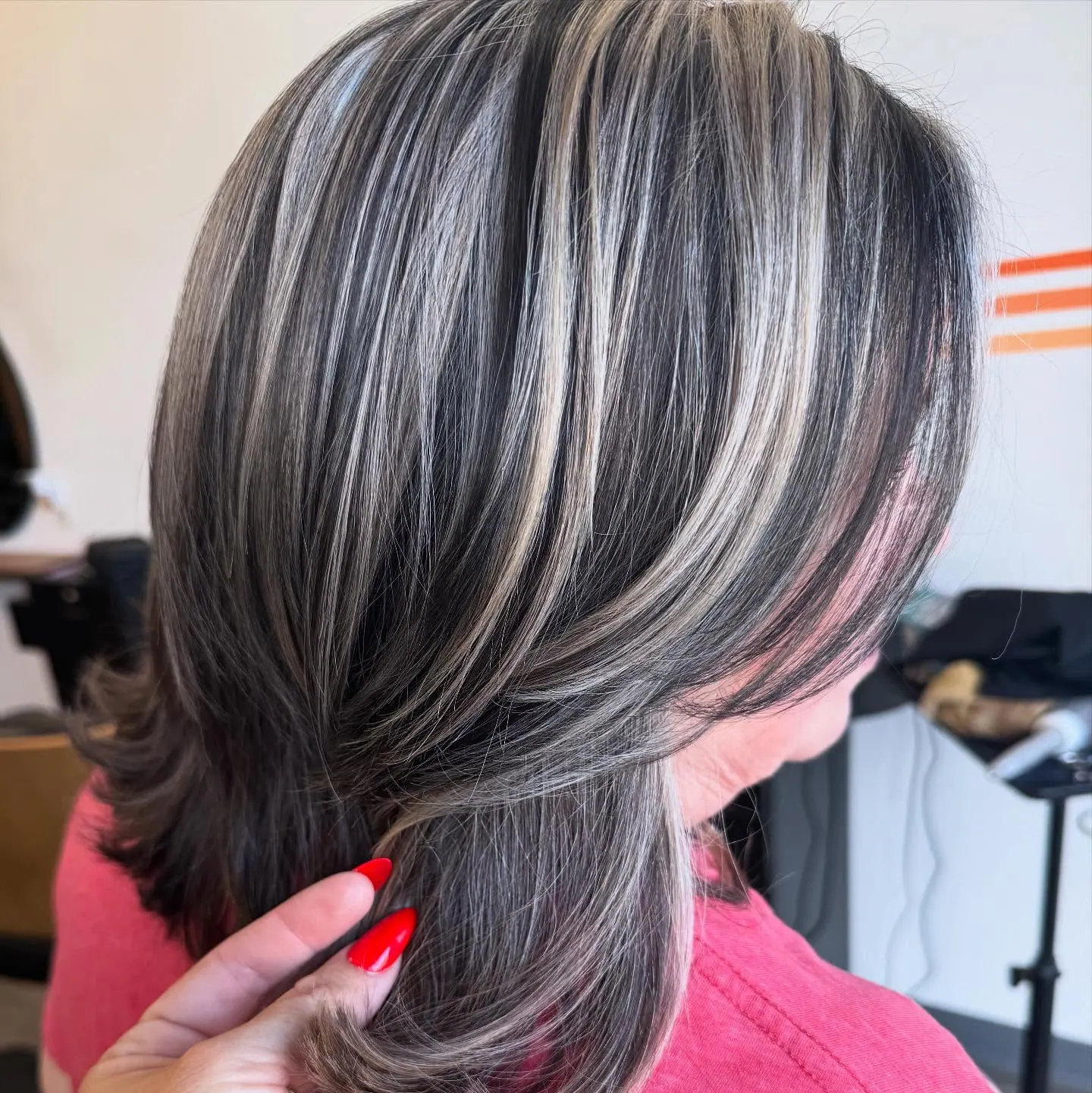 Woman with white highlights on a salt & pepper base.