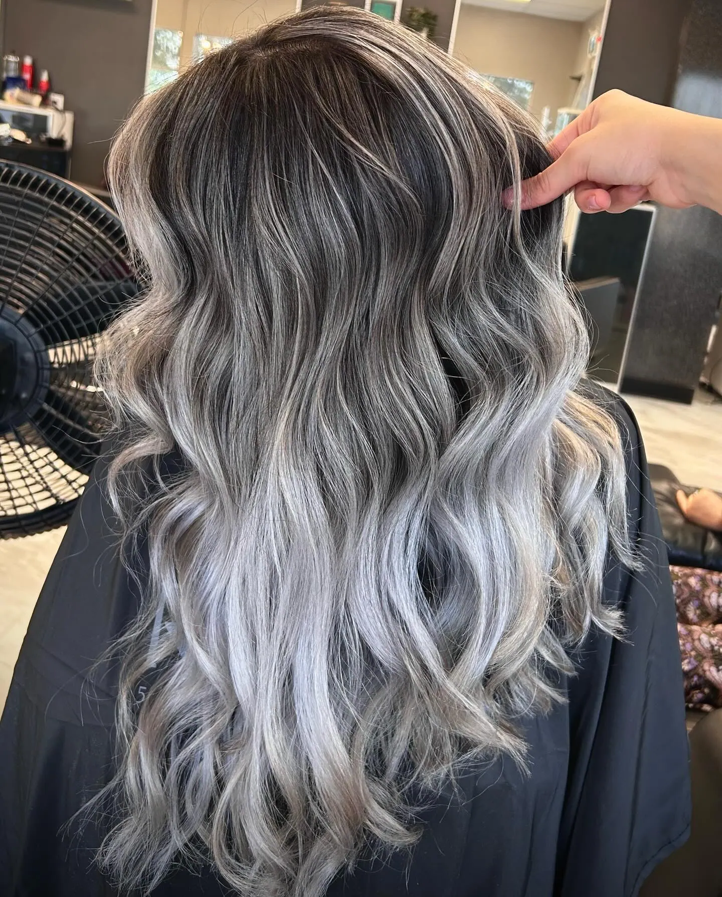Woman with salt & pepper balayage and ombre.