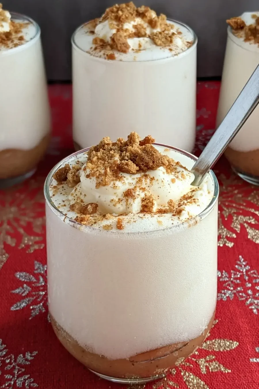 Fluffy apple mousse dessert with smooth, airy whipped egg whites on a bed of homemade apple sauce.