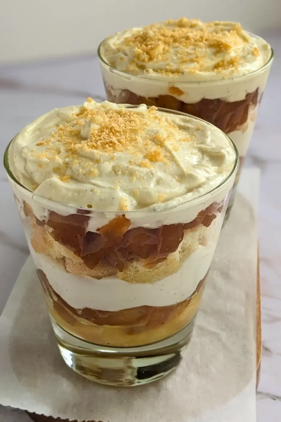 Layered apple tiramisu dessert with creamy mascarpone and Greek yogurt filling.