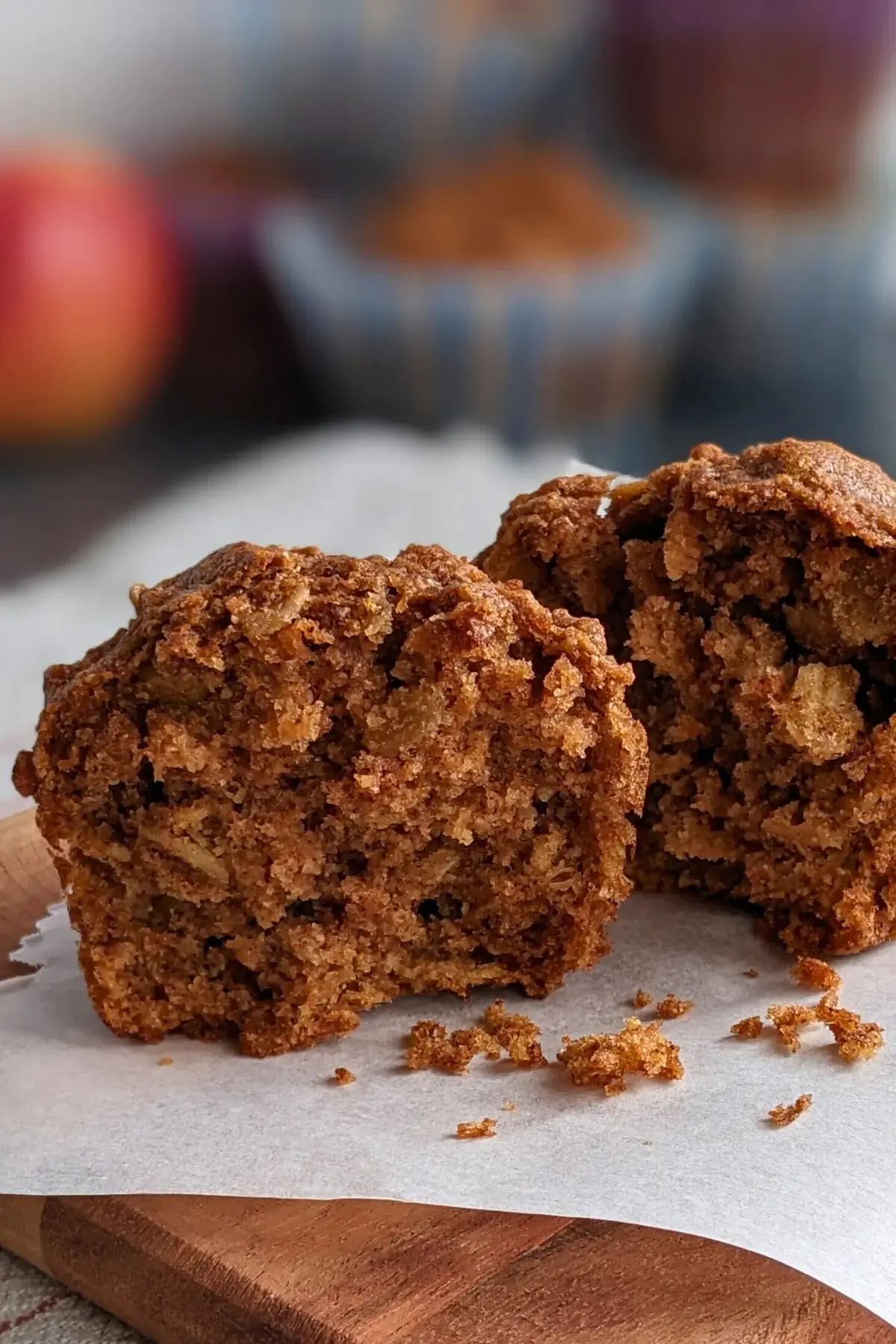 Moist whole wheat apple muffins with chunks of apple, oats, and a touch of brown sugar.
