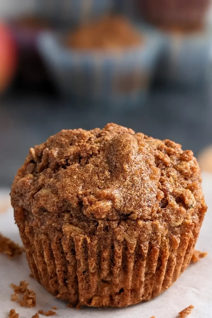 Moist whole wheat apple muffins with chunks of apple, oats, and a touch of brown sugar.
