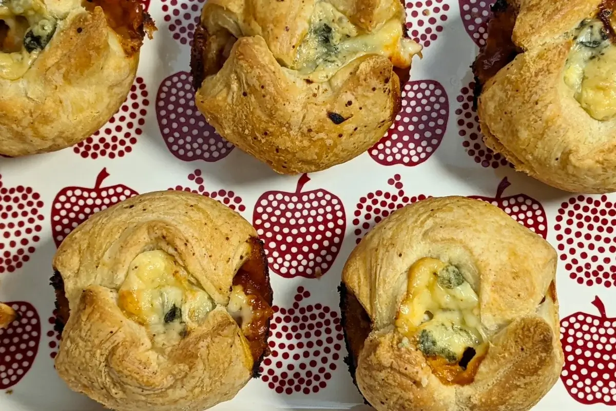 Prosciutto and blue cheese puff pastry appetizers - savory puff pastry cups filled with sweet chili sauce, prosciutto and blue cheese.
