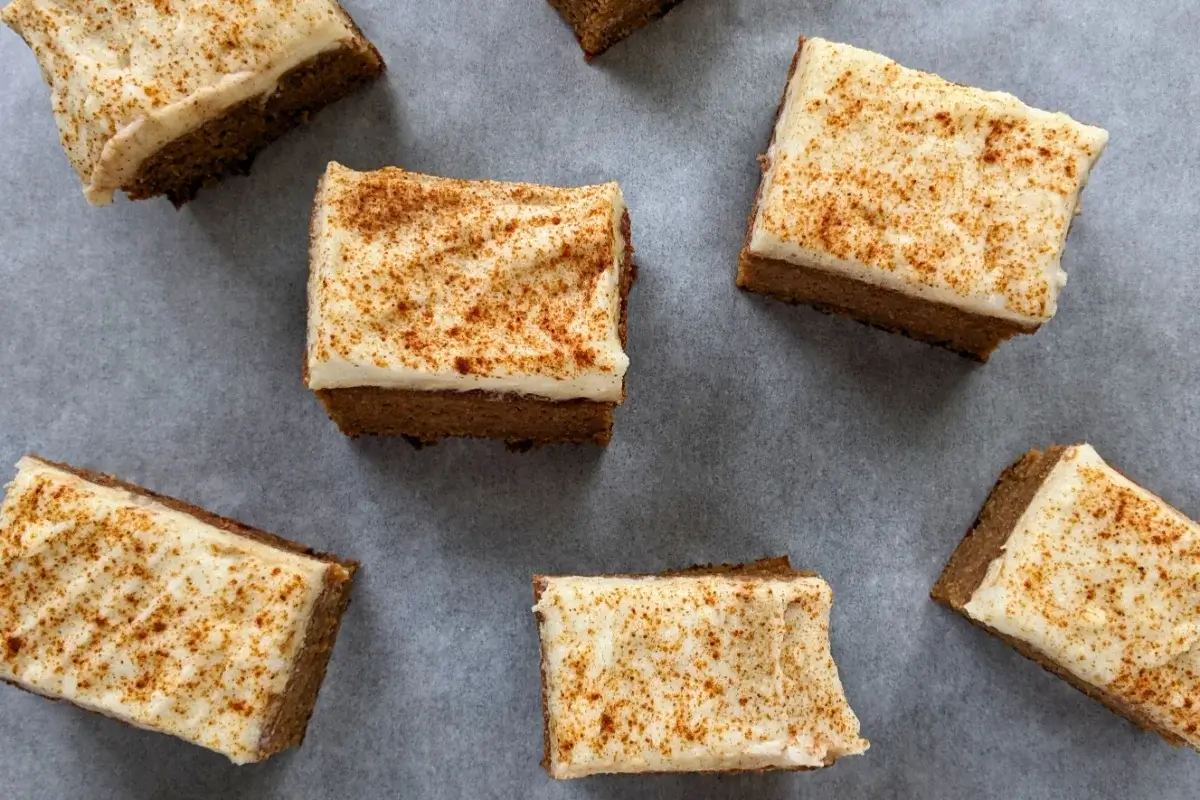 Pumpkin bars made with applesauce and topped with light, sugar-free frosting.