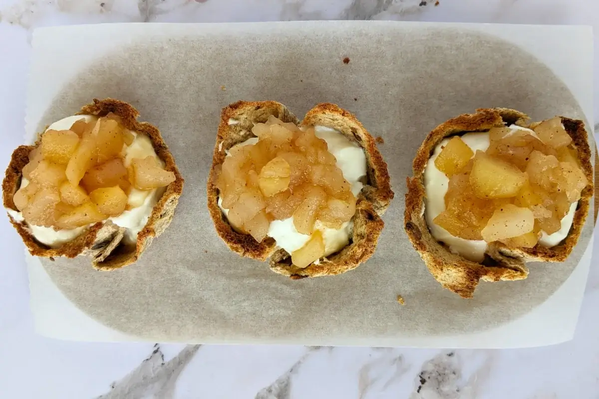 Ricotta and homemade apple sauce dessert toast cups - Muffin tin toasted bread cups with creamy ricotta filling and a generous spoonful of spiced homemade apple sauce.