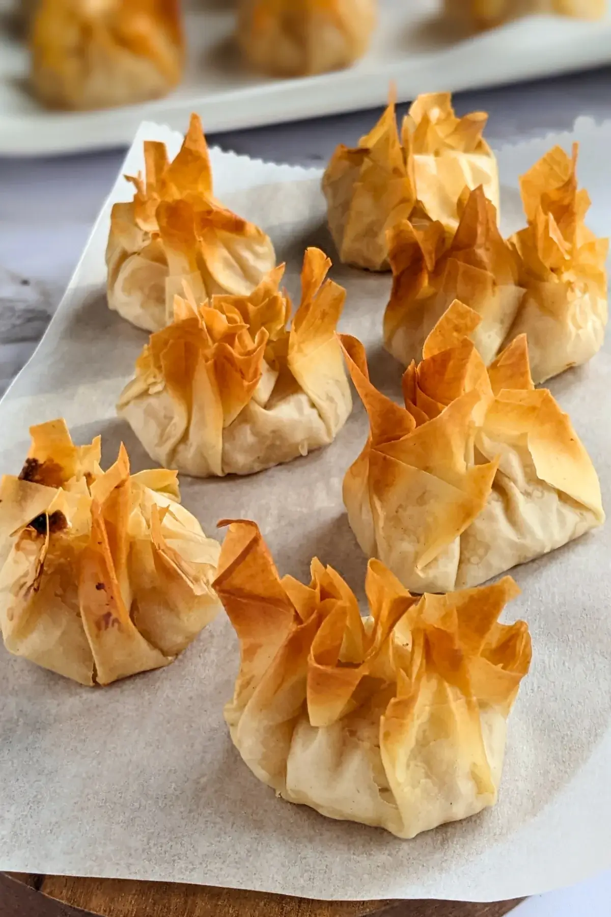 Apple and ricotta phyllo dessert parcels - Golden phyllo pastry dessert parcels filled with ricotta and homemade apple sauce, lightly crisped.
