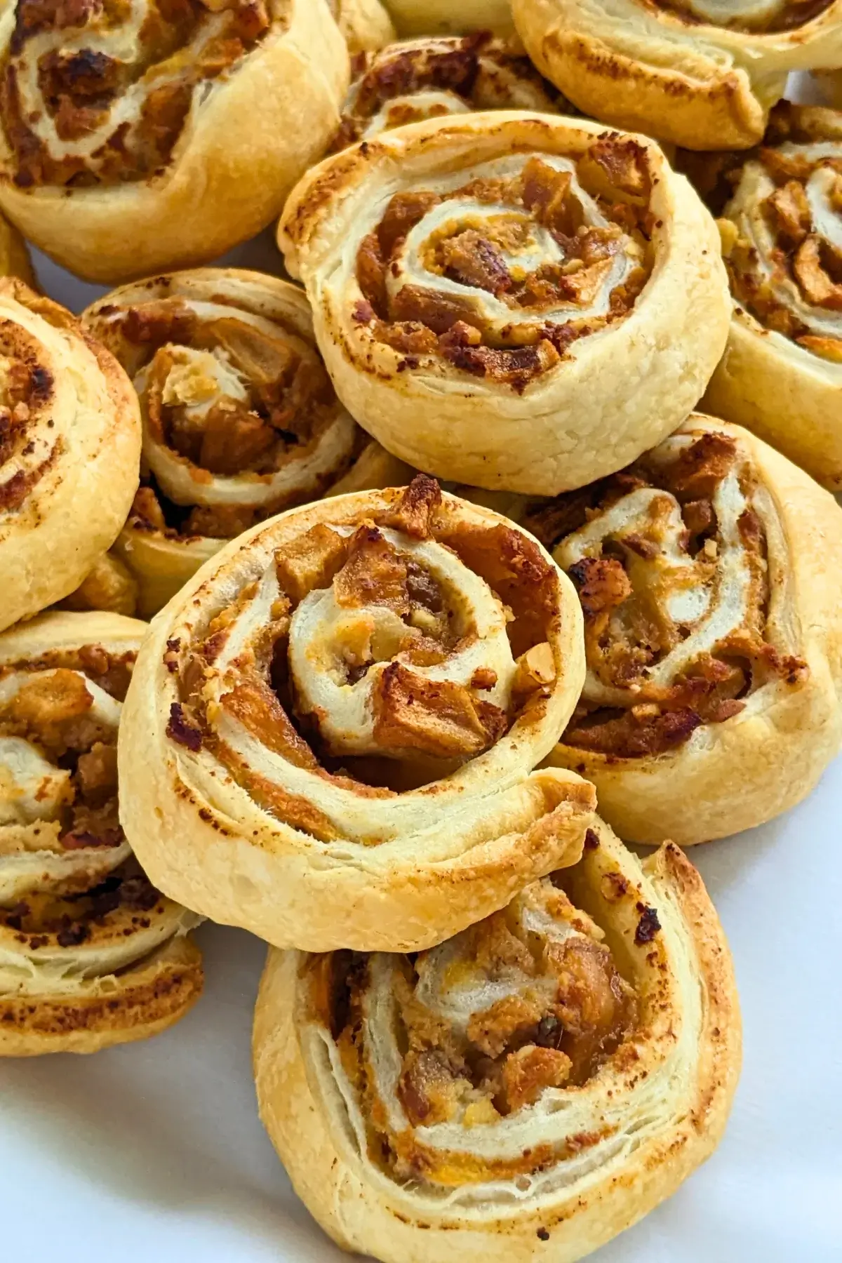 Apple puff pastry rolls with ricotta - Rolled puff pastry filled with ricotta, cinnamon apples, and walnuts.
