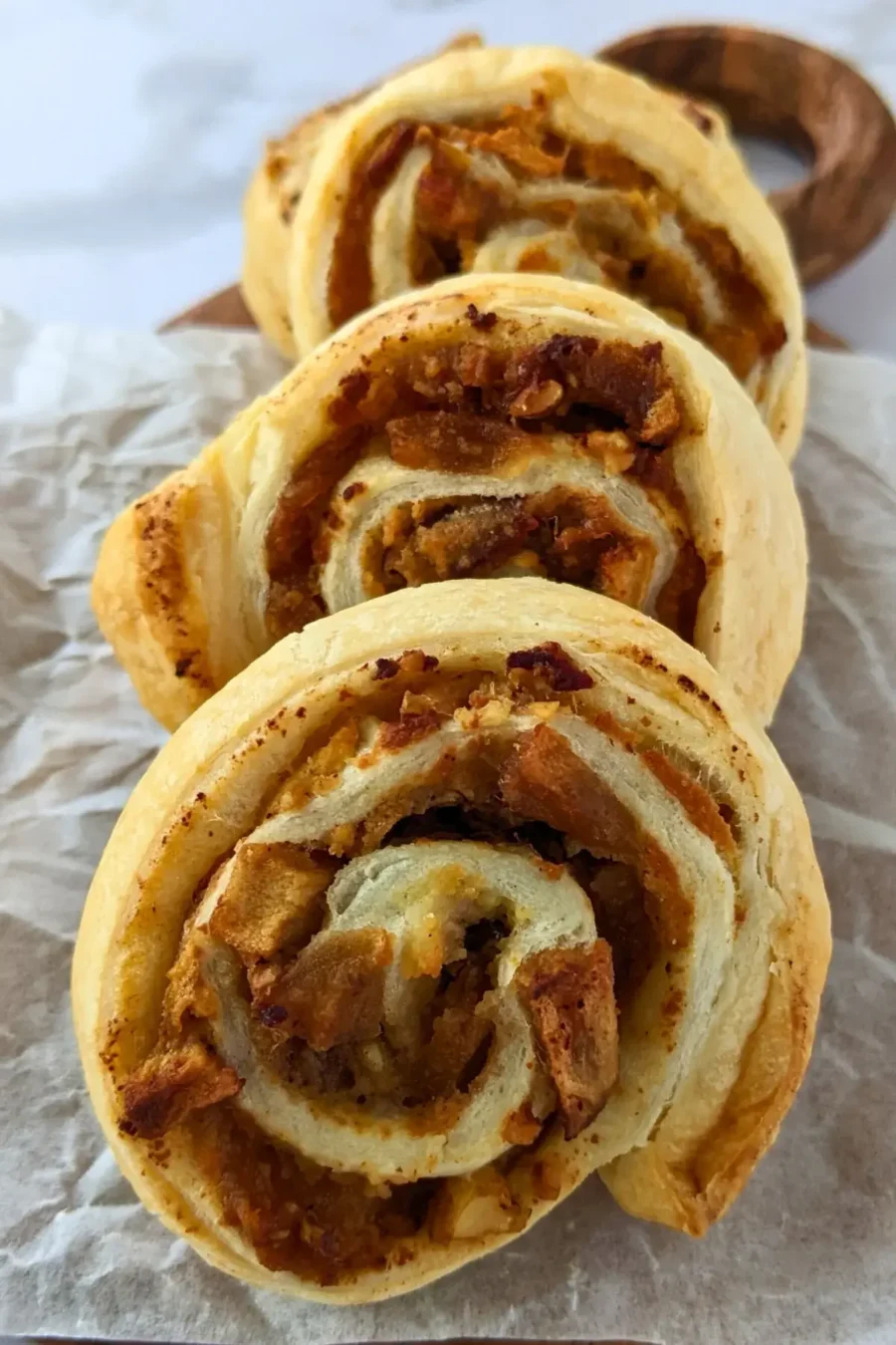 Apple puff pastry rolls with ricotta - Rolled puff pastry filled with ricotta, cinnamon apples, and walnuts.