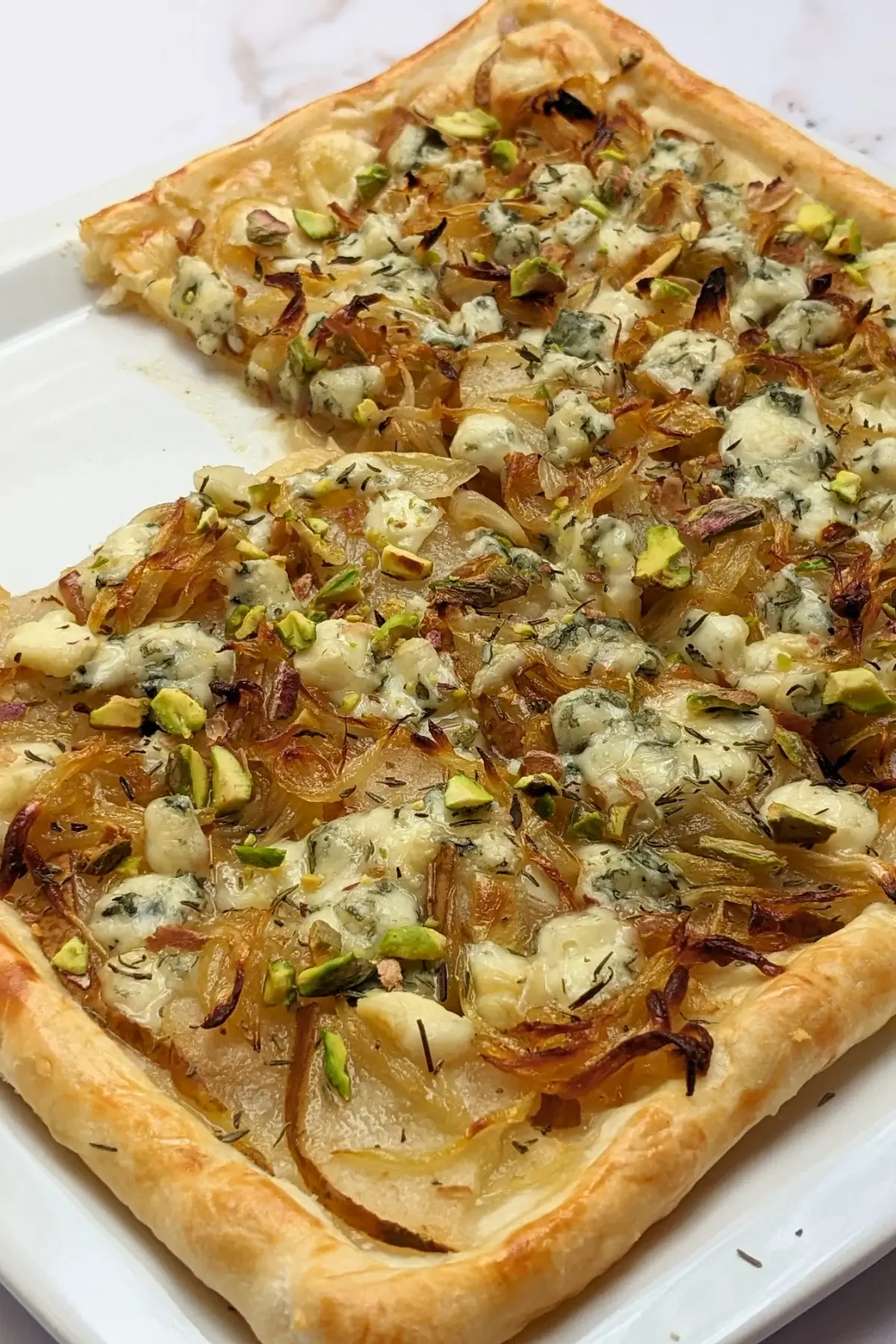 Caramelized Onion, Pear, and Blue Cheese Puff Pastry Tart - puff pastry appetizer with caramelized onions, fresh pears and crumbled blue cheese.