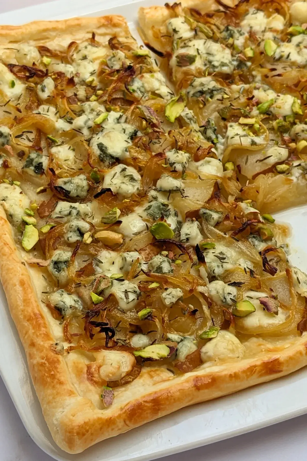 Caramelized Onion, Pear, and Blue Cheese Puff Pastry Tart - puff pastry appetizer with caramelized onions, fresh pears and crumbled blue cheese.