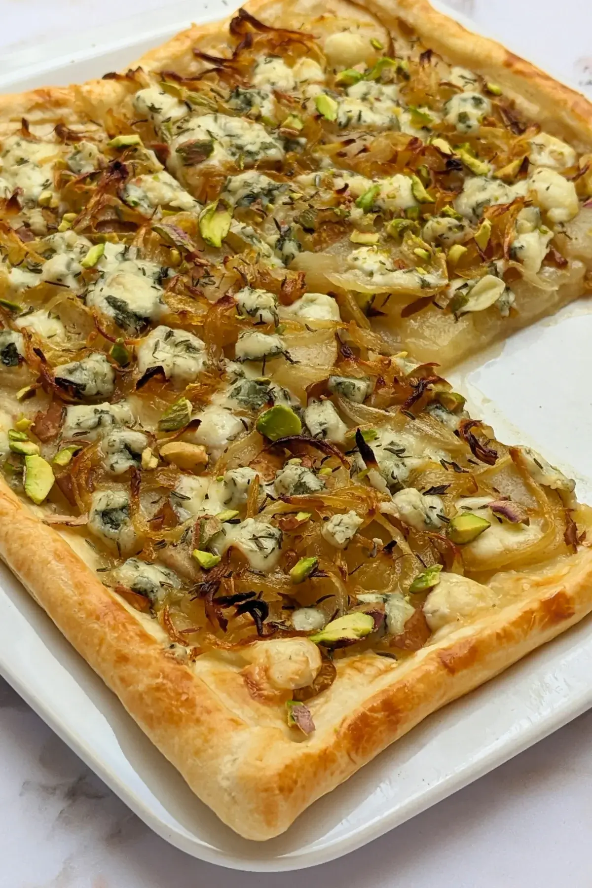 Caramelized Onion, Pear, and Blue Cheese Puff Pastry Tart - puff pastry appetizer with caramelized onions, fresh pears and crumbled blue cheese.