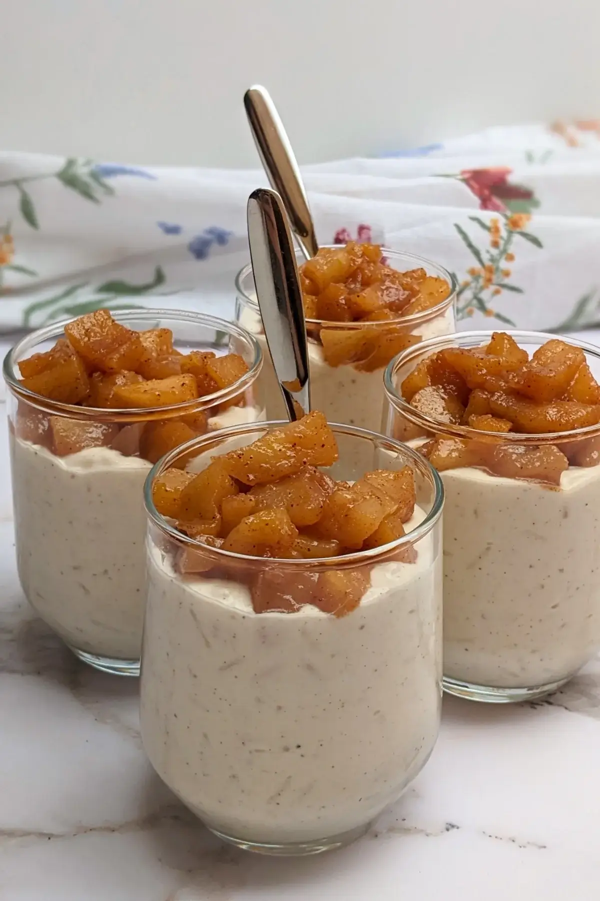 Cinnamon apple rice pudding - rice pudding dessert made with cooked rice and a whipped cream and ricotta blend, topped with cinnamon butter apple pie filling.