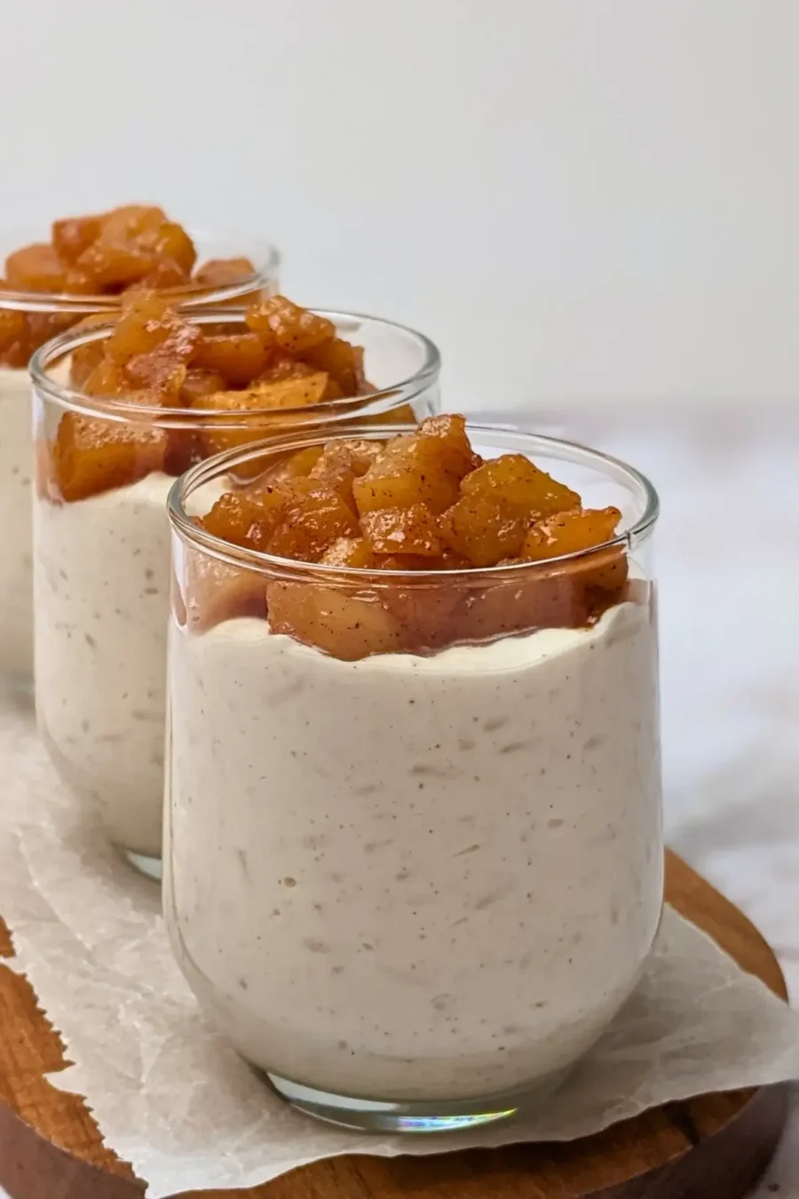 Cinnamon apple rice pudding - rice pudding dessert made with cooked rice and a whipped cream and ricotta blend, topped with cinnamon butter apple pie filling.