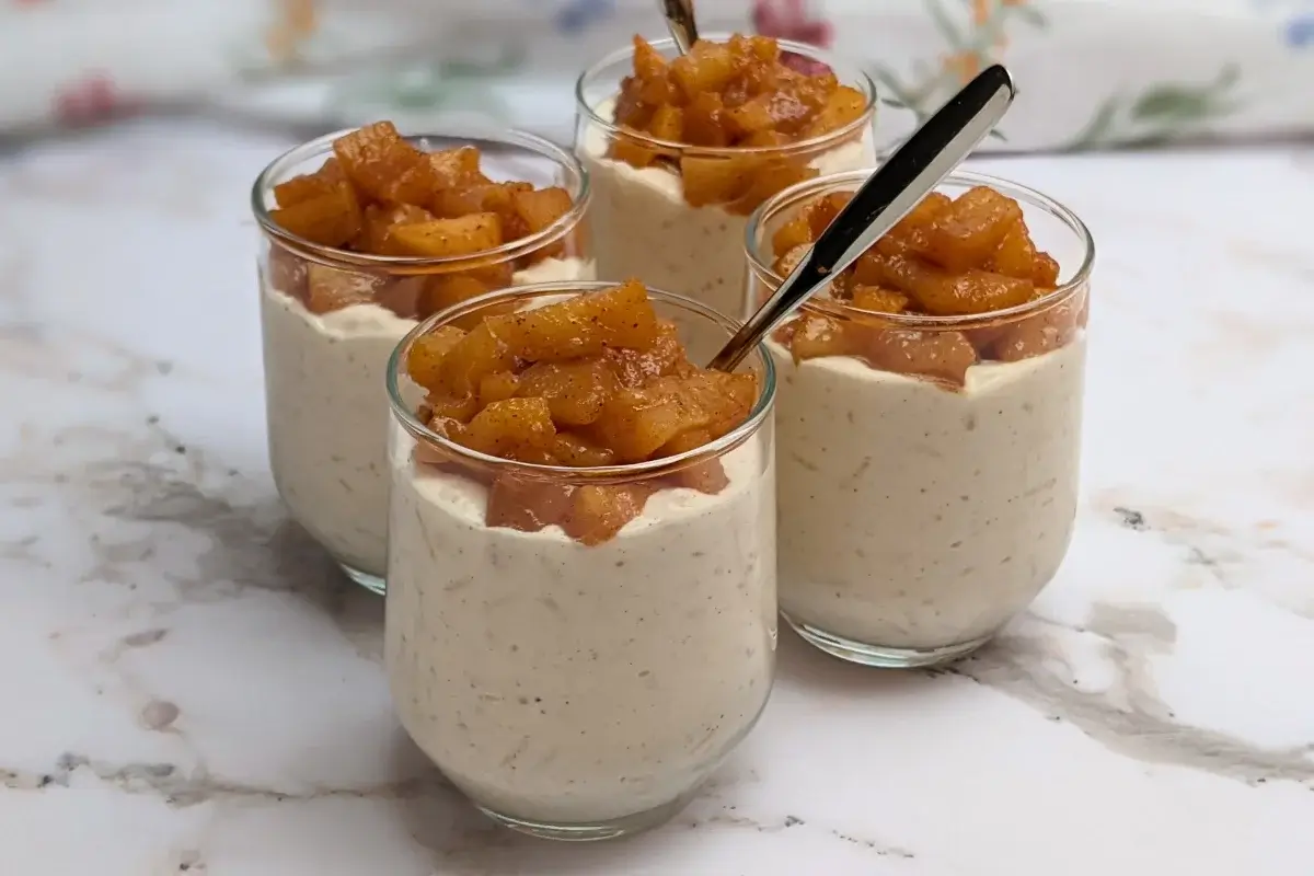 Cinnamon apple rice pudding - rice pudding dessert made with cooked rice and a whipped cream and ricotta blend, topped with cinnamon butter apple pie filling.