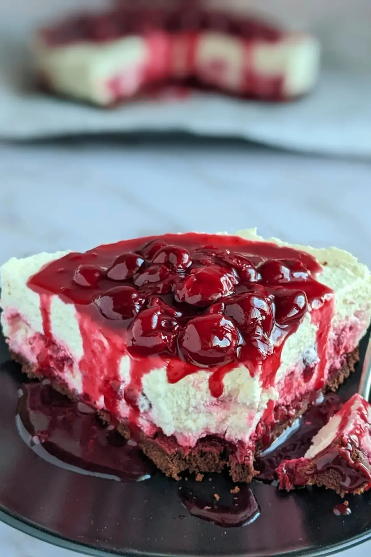 No Bake Cheesecake With Cherry Topping - easy no bake cheesecake on a chocolate cookie crumb base, made with fluffy whipped cream and cottage cheese, and topped with homemade cherry compote.