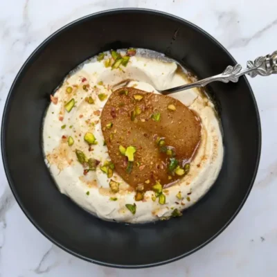 Poached pears with mascarpone cream - a dessert with cinnamon and pumpkin spiced oven-roasted pears served with a fluffy mascarpone and Greek yogurt cream.