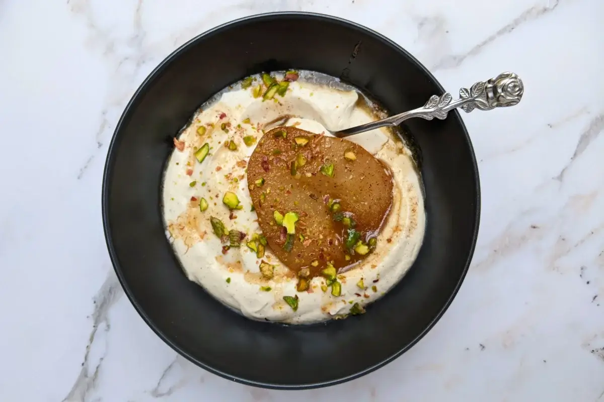 Poached pears with mascarpone cream - a dessert with cinnamon and pumpkin spiced oven-roasted pears served with a fluffy mascarpone and Greek yogurt cream.