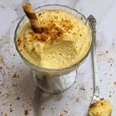 Pumpkin mousse - a fluffy and airy pumpkin dessert with whipped egg whites, whipped cream, pumpkin puree, sugar, and spices.