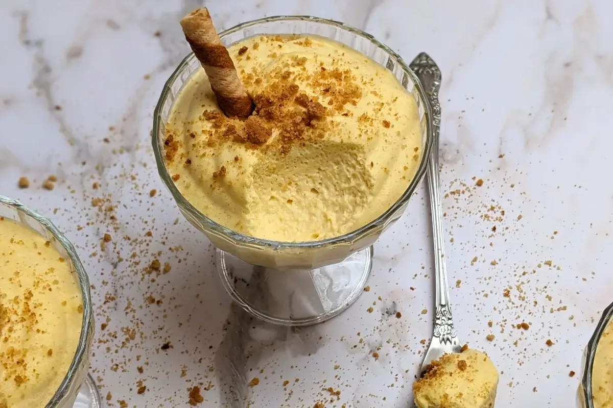 Pumpkin mousse - a fluffy and airy pumpkin dessert with whipped egg whites, whipped cream, pumpkin puree, sugar, and spices.