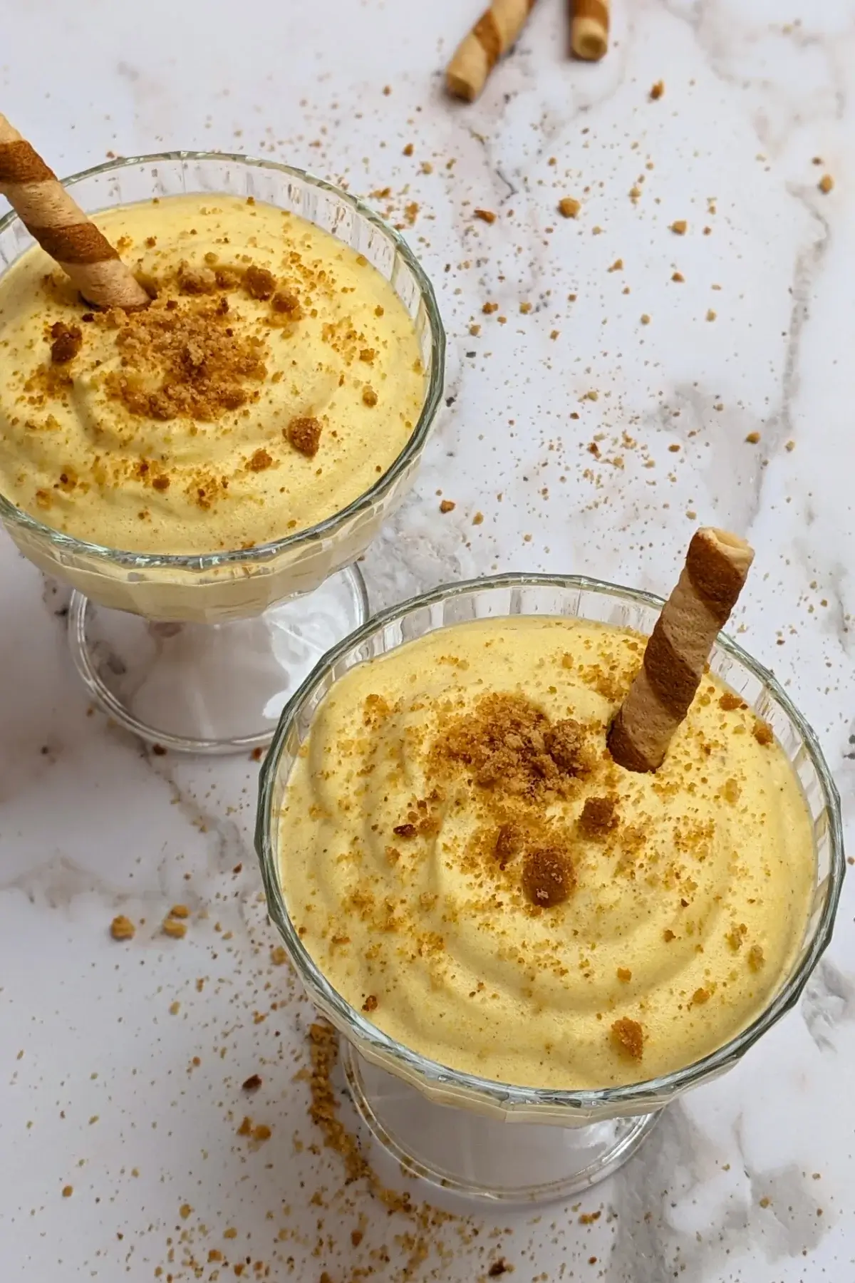 Pumpkin mousse - a fluffy and airy pumpkin dessert with whipped egg whites, whipped cream, pumpkin puree, sugar, and spices.