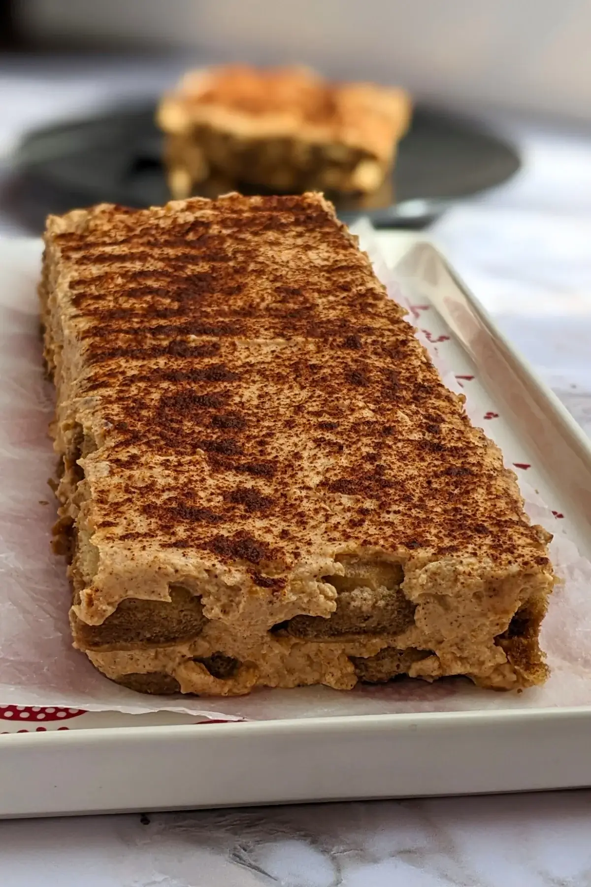 Pumpkin Tiramisu - a low-fat, low-sugar pumpkin dessert made with mascarpone and Greek yogurt, sugar or sweetener, pumpkin puree, and ladyfinger biscuits.