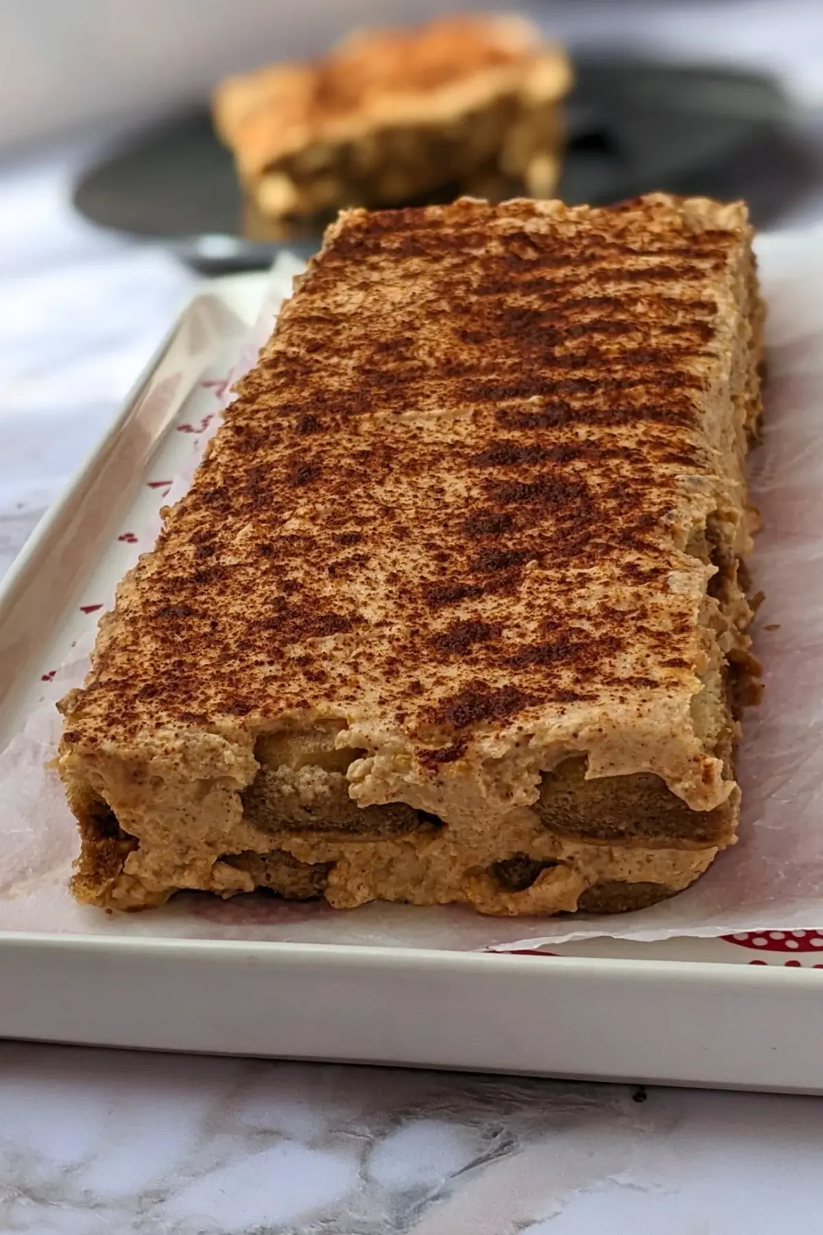 Pumpkin Tiramisu - a low-fat, low-sugar pumpkin dessert made with mascarpone and Greek yogurt, sugar or sweetener, pumpkin puree, and ladyfinger biscuits.