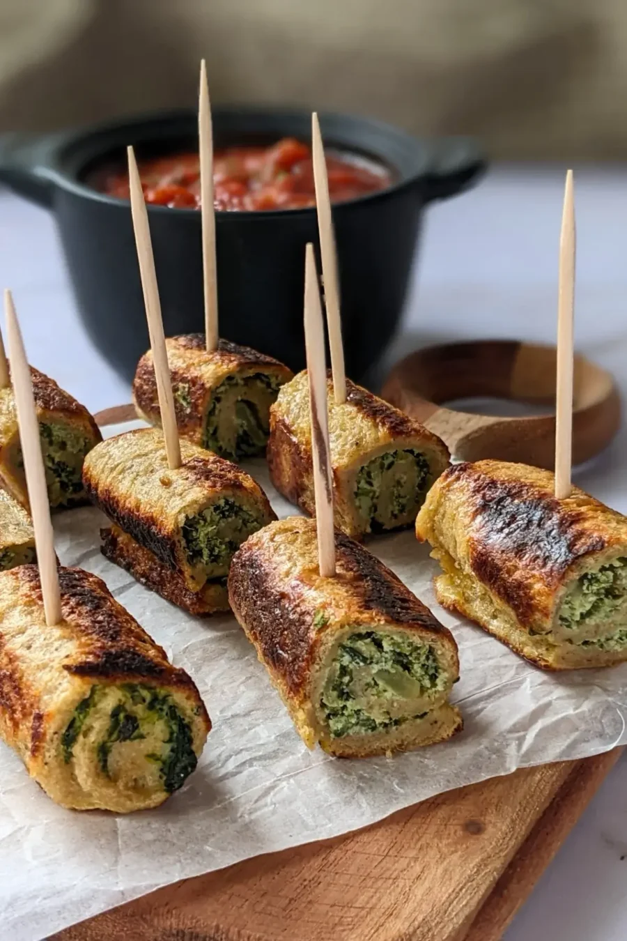 Italian-style savory stuffed French toast appetizers with a garlicky spinach and ricotta mix served with marinara sauce.