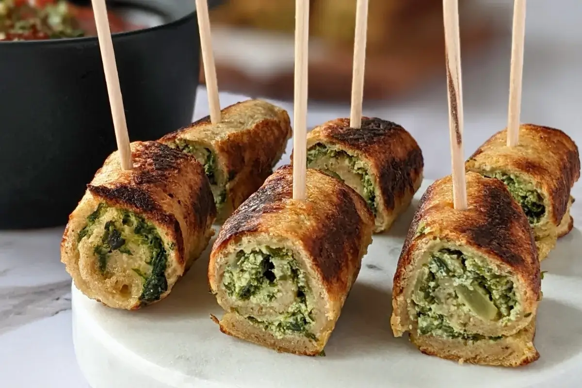 Italian-style savory stuffed French toast appetizers with a garlicky spinach and ricotta mix served with marinara sauce.