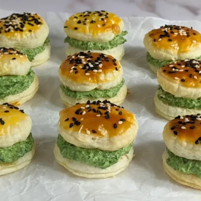 Goat Cheese Spinach Puffs - puff pastry appetizers made with a goat cheese-spinach filling, sandwiched between homemade puff pastry shells. These look really festive with the green color!