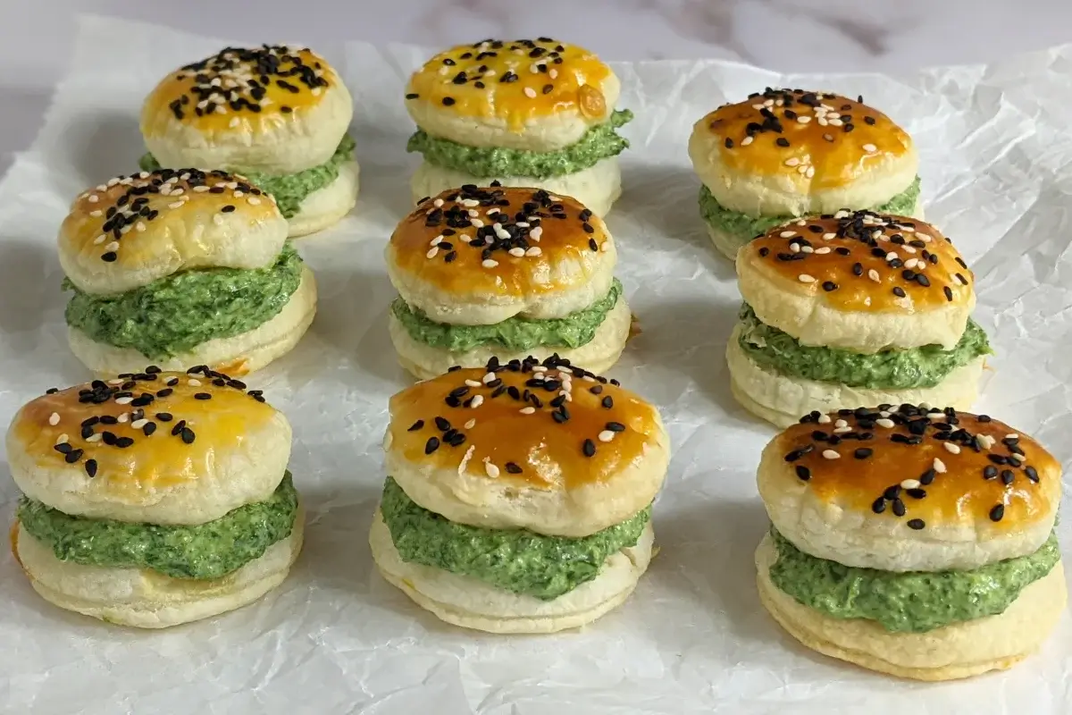 Goat Cheese Spinach Puffs - puff pastry appetizers made with a goat cheese-spinach filling, sandwiched between homemade puff pastry shells. These look really festive with the green color!